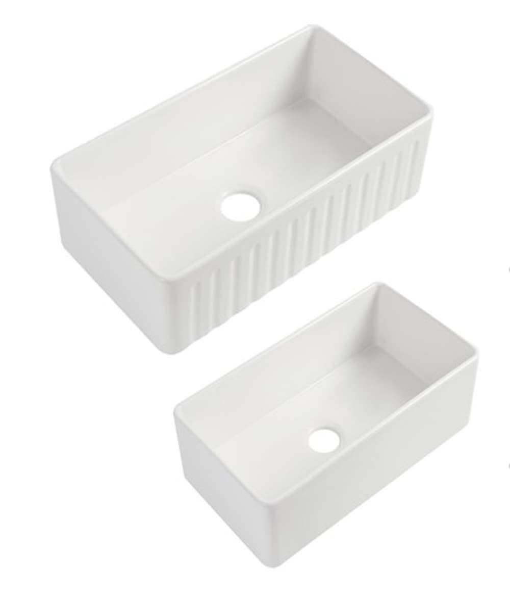 Gloss white fireclay butler kitchen sinks with fluted front, modern rectangular design.